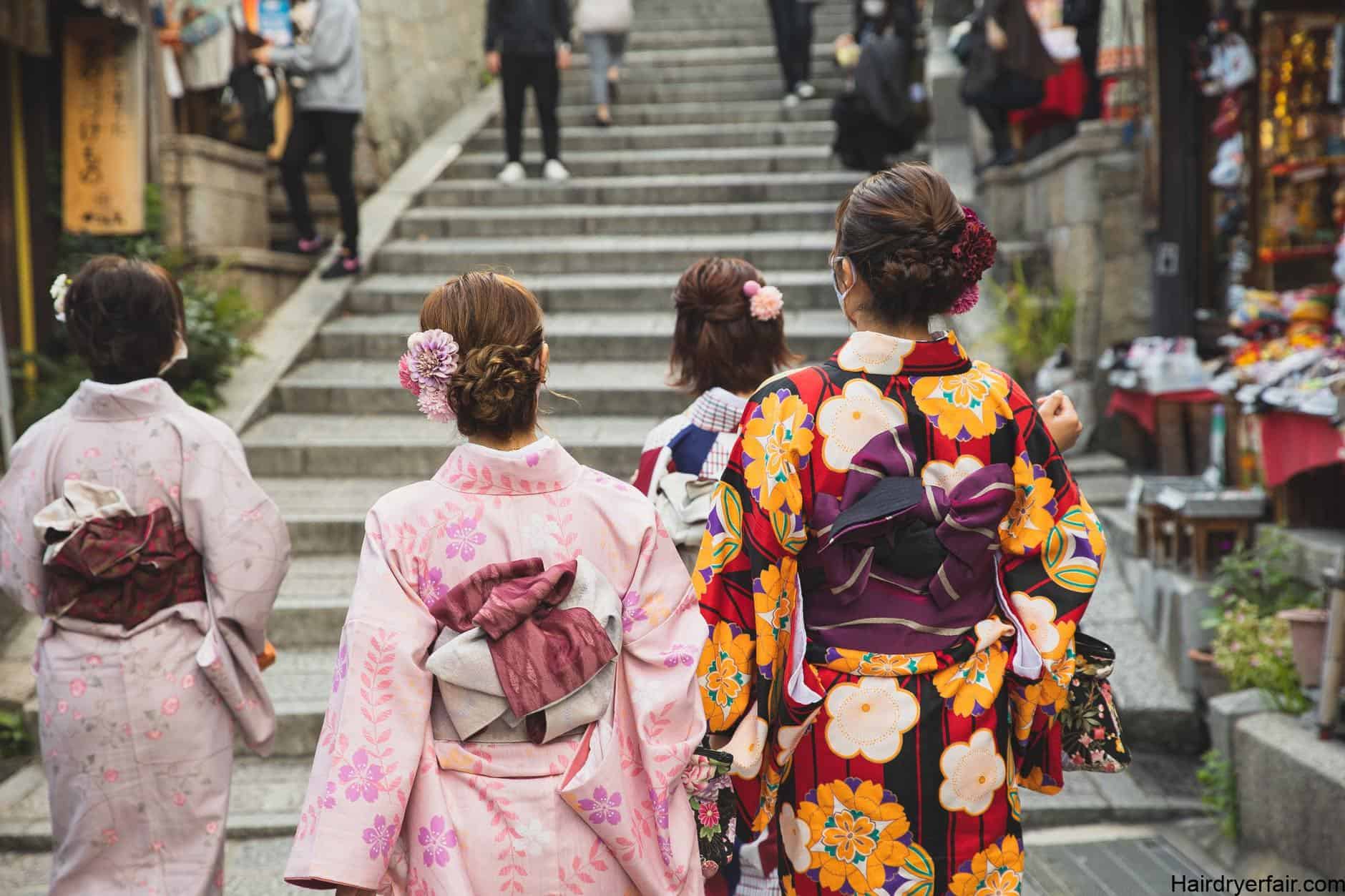 group of asian women in kimonos on street