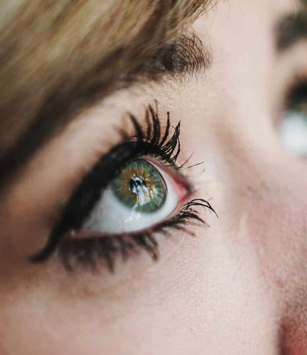 person s eye in close up photography